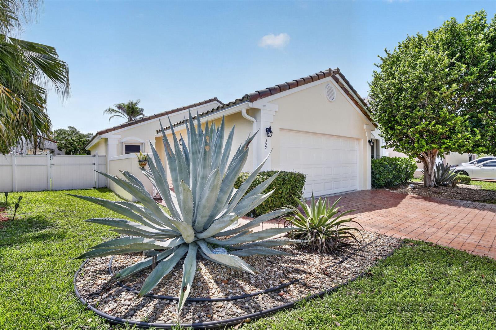 A single-story house with a large agave plant in the front yard and a garage — 327 SW 191st Terrace, Pembroke Pines FL 33029, PEMBROKE PINES, FL