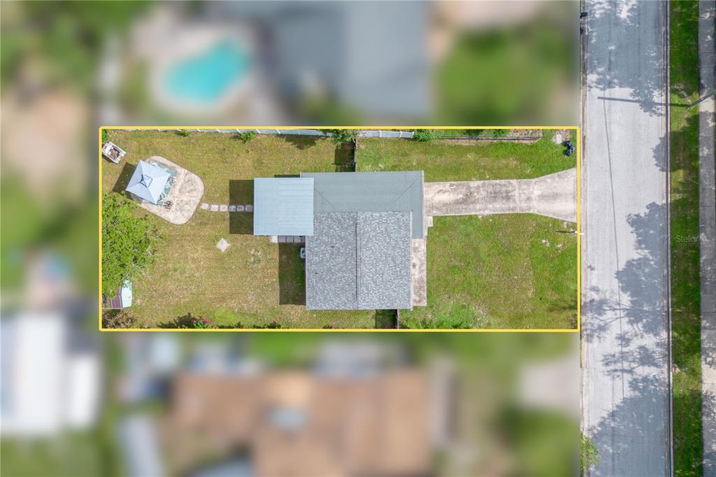 An aerial view shows a house with a driveway, backyard, and a detached gazebo — 1333 S DENNING DRIVE, WINTER PARK, FL