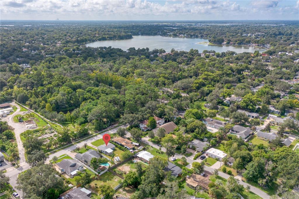 An aerial view shows a residential neighborhood with a red pin marking a single-family home — 1333 S DENNING DRIVE, WINTER PARK, FL