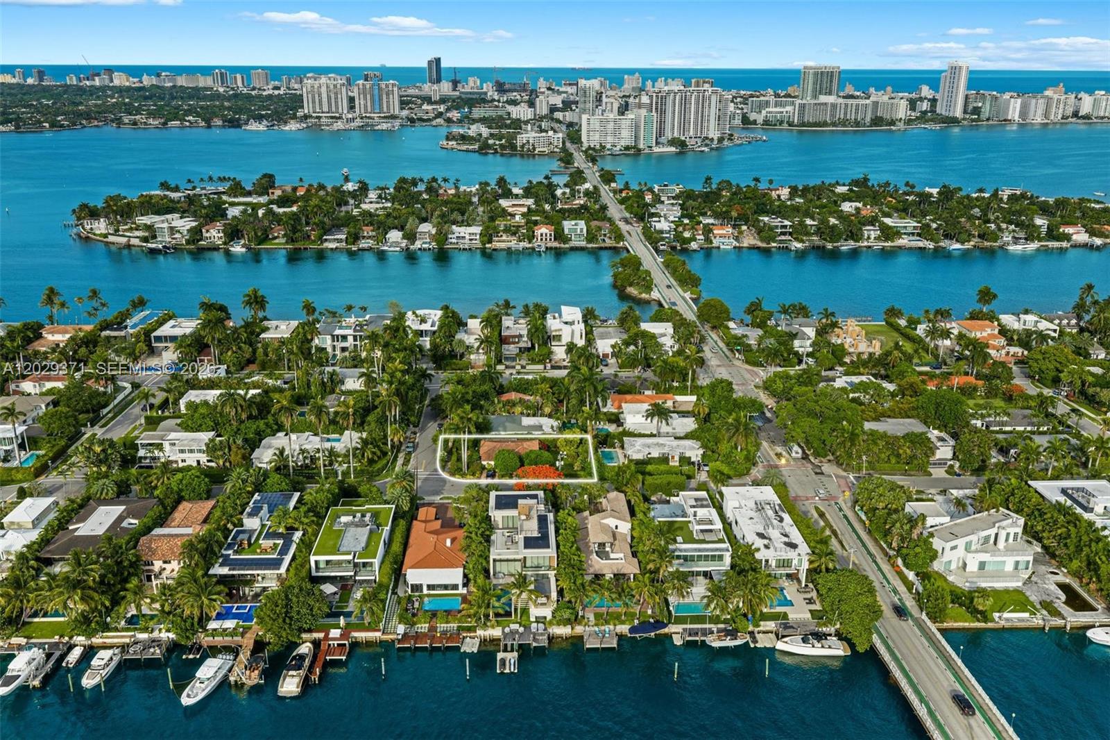 An aerial view shows a residential property outlined in white within a waterfront neighborhood — 455 W Dilido Dr, Miami Beach FL 33139, MIAMI BEACH, FL