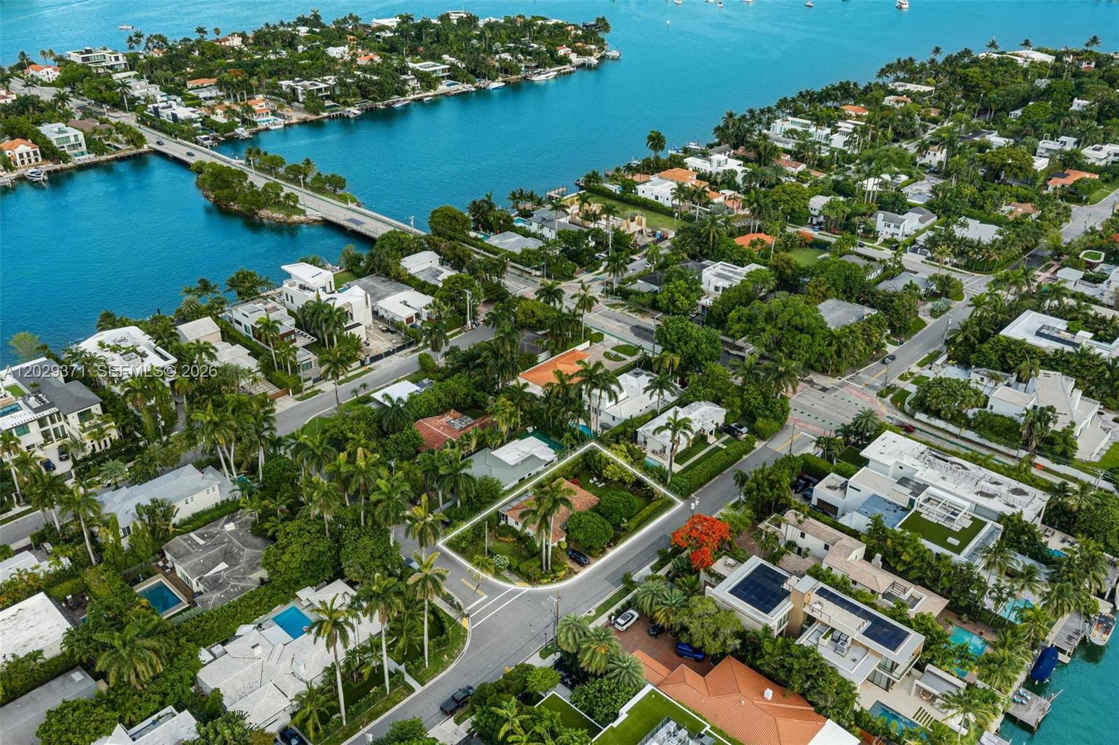 An aerial view shows a single-story house with a yard outlined in white on a corner — 455 W Dilido Dr, Miami Beach FL 33139, MIAMI BEACH, FL