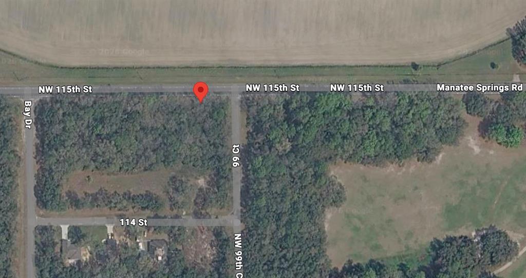 This is an aerial map view of a wooded lot located at a street intersection — 00 NW 115TH STREET, CHIEFLAND, FL