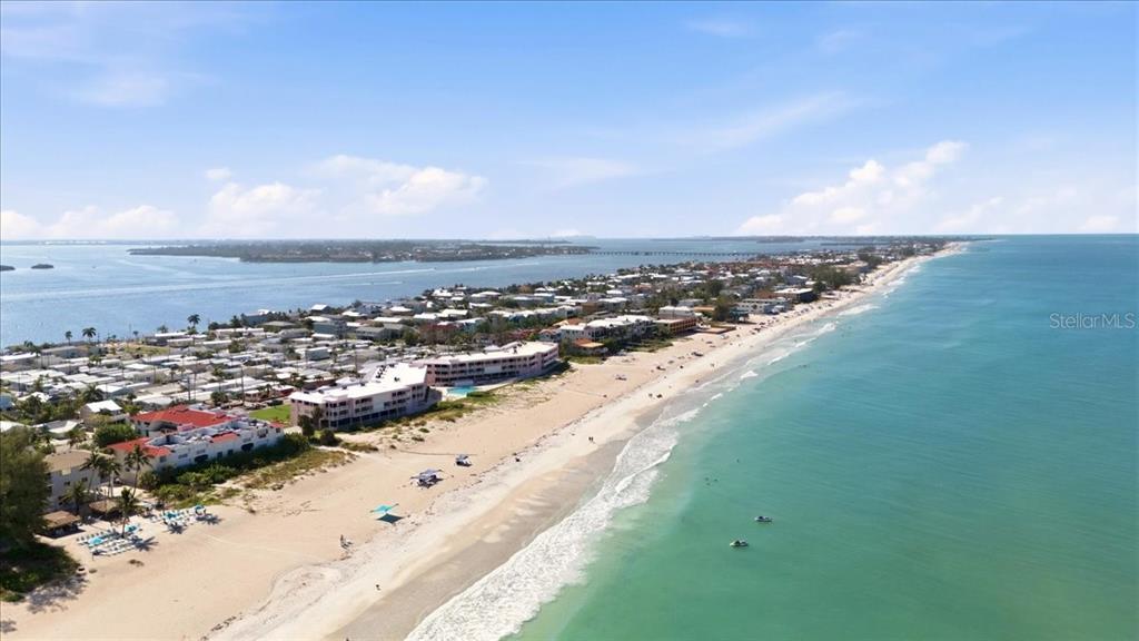 An aerial view of a sandy beach coastline with residential buildings and the ocean — 2600 GULF DRIVE N UNIT 30, BRADENTON BEACH, FL