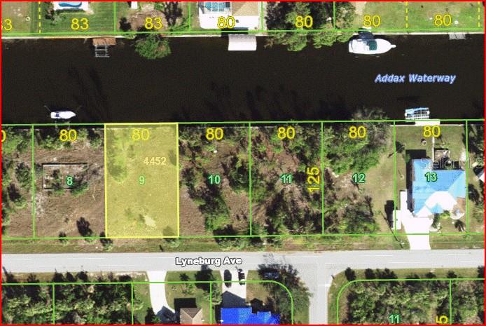 This is an aerial map showing a vacant residential lot highlighted in yellow along a canal — 15108 LYNEBURG AVENUE, PORT CHARLOTTE, FL