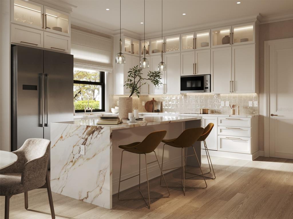 This is a rendering of a modern kitchen featuring a marble waterfall island and cabinetry — 311 CAMPBELL STREET, PORT CHARLOTTE, FL