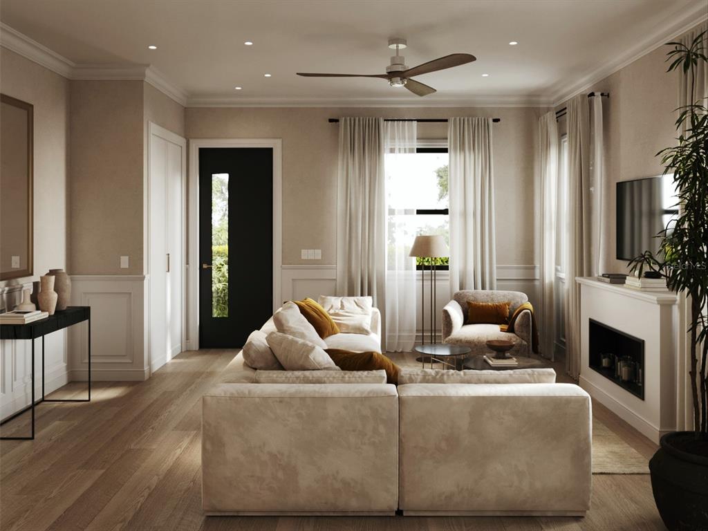 This is a rendering of a living room featuring a sectional sofa, fireplace, and black door — 311 CAMPBELL STREET, PORT CHARLOTTE, FL