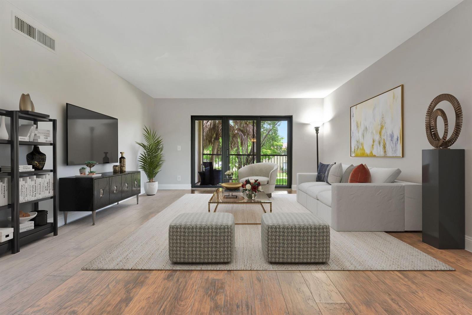A dining room features a wooden table with eight chairs, a pendant light, and hardwood floors — 334 Lakeview Drive # 204, Weston FL 33326, WESTON, FL