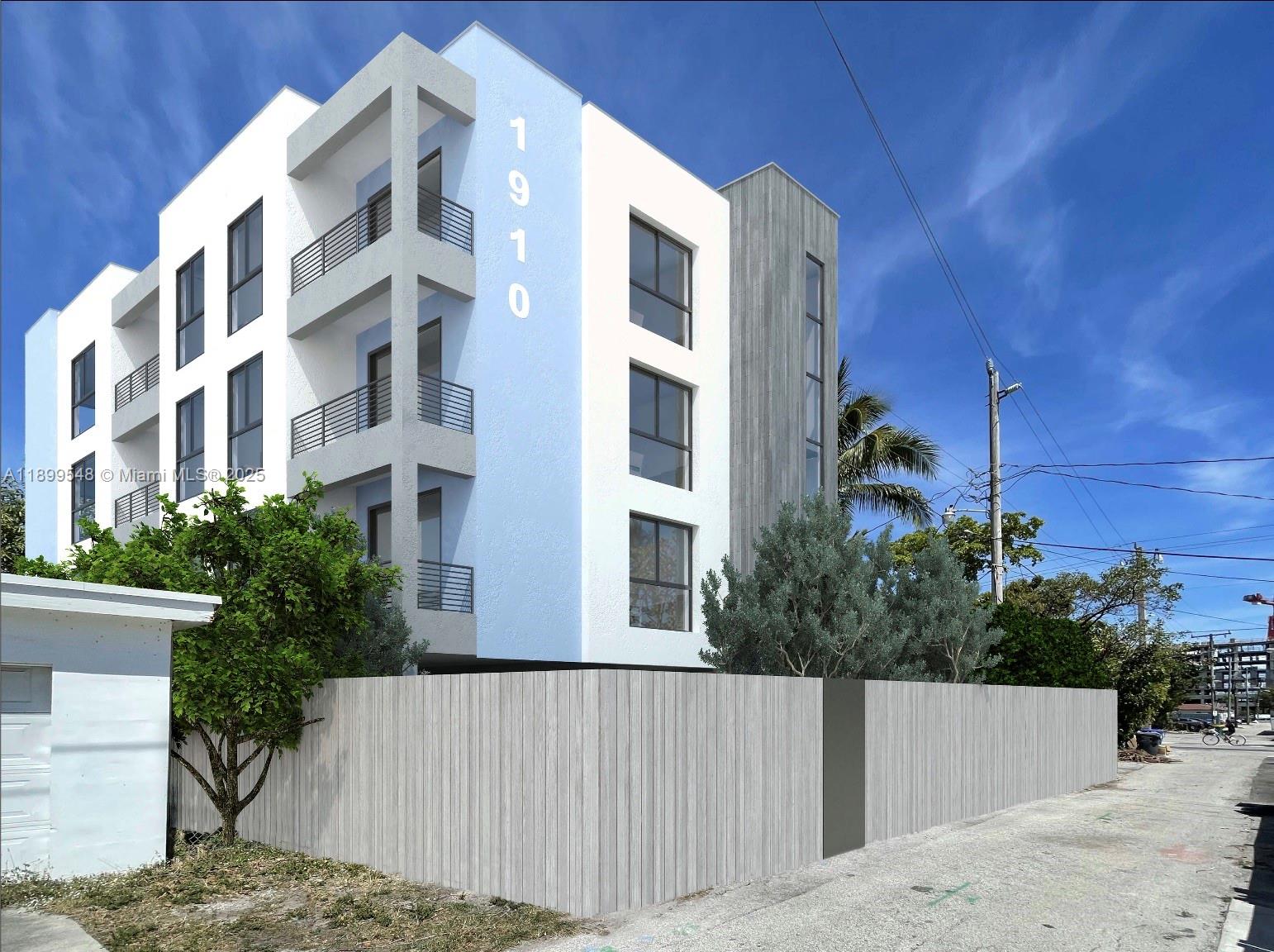 This is a digital rendering of a modern three-story apartment building with a wooden fence — 1910 Washington St, Hollywood FL 33020, HOLLYWOOD, FL