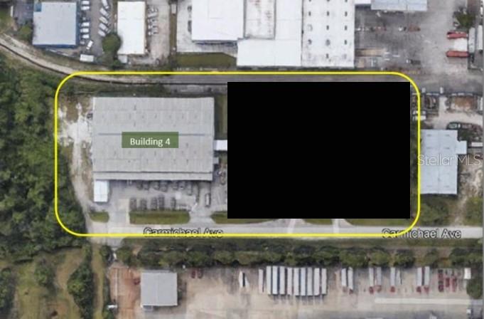 This aerial map shows a commercial building labeled Building 4 with an adjacent blacked-out area — 4500 CARMICHAEL AVENUE UNIT Building 4, SARASOTA, FL