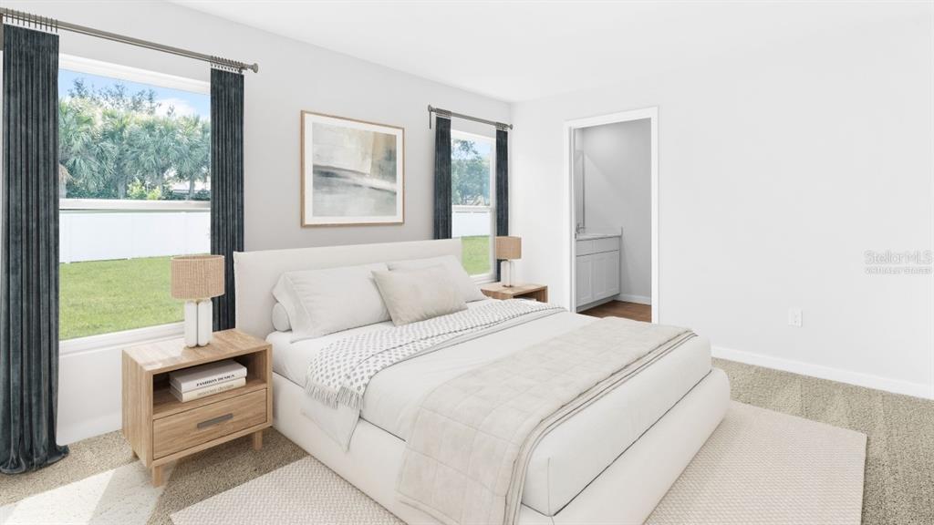 This is a virtually staged bedroom with a bed, two nightstands, and an attached bathroom — 5168 SCHUBERT TRAIL, NORTH PORT, FL