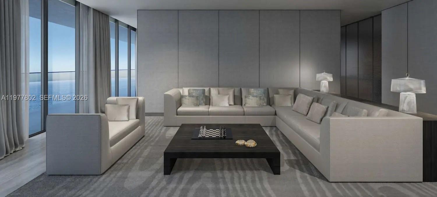 This rendering shows a modern living room with a large sectional sofa and coffee table — PJMRCE04B East Crescent # 0, Dubai, FL