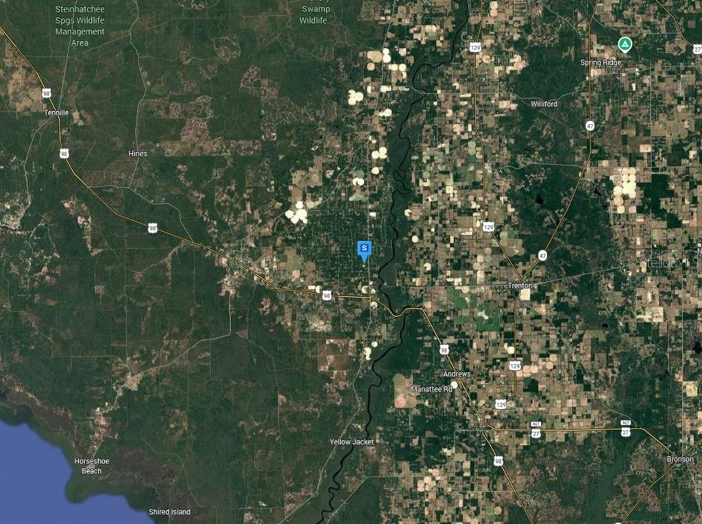 This is a satellite map showing rural land, agricultural fields, and roads in Florida — 11 NE 717TH ST, OLD TOWN, FL