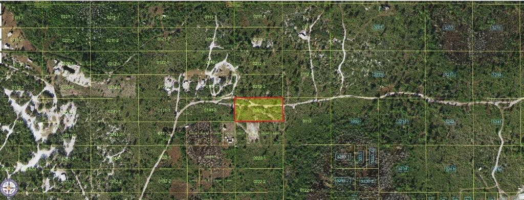 This is an aerial map showing a highlighted rectangular plot of land amidst wooded terrain — HOLOPAW GROVES ROAD, ST CLOUD, FL
