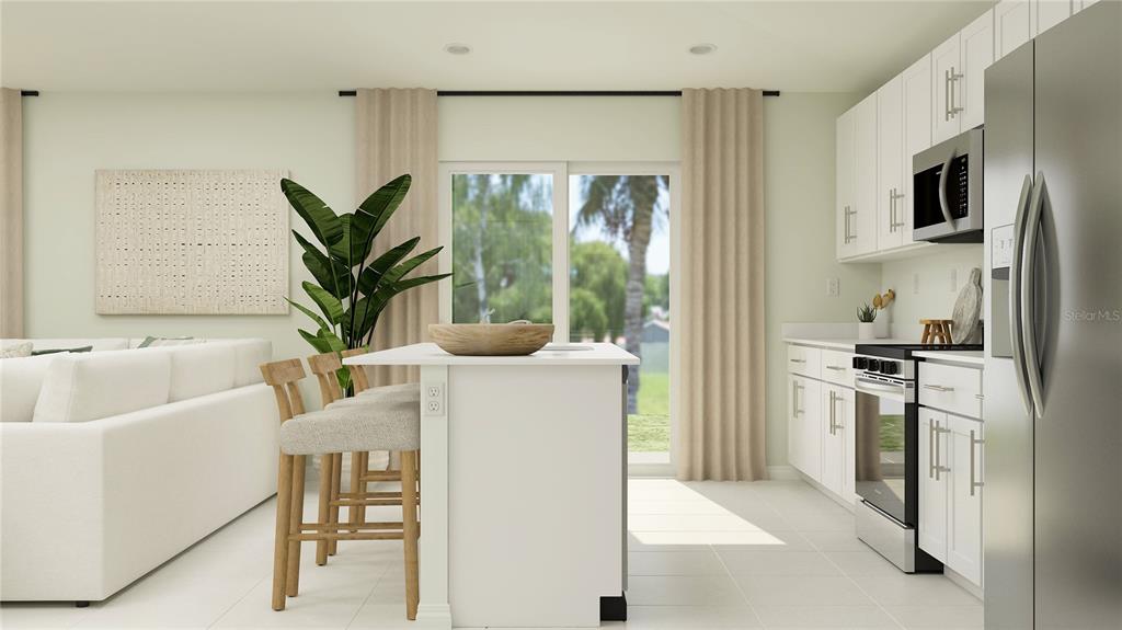 This rendering shows a modern kitchen with white cabinets, a center island, and stainless appliances — 5940 YELLOW HORNBILL AVENUE, WIMAUMA, FL