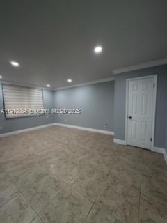 A room with light gray walls, tile flooring, recessed lighting, and a white interior door — 1805 W 56th St # 412, Hialeah FL 33012, HIALEAH, FL