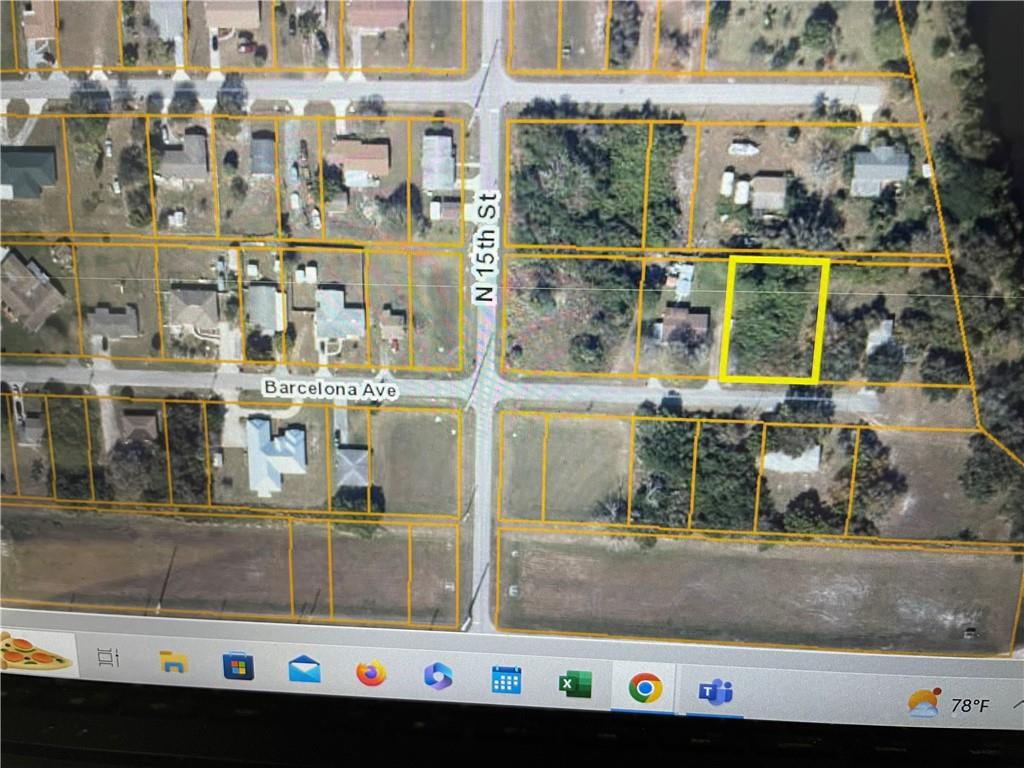 This aerial map shows a vacant residential lot highlighted in yellow near a street intersection — O BARCELONA AVE, Fort Pierce FL 34946, FORT PIERCE, FL