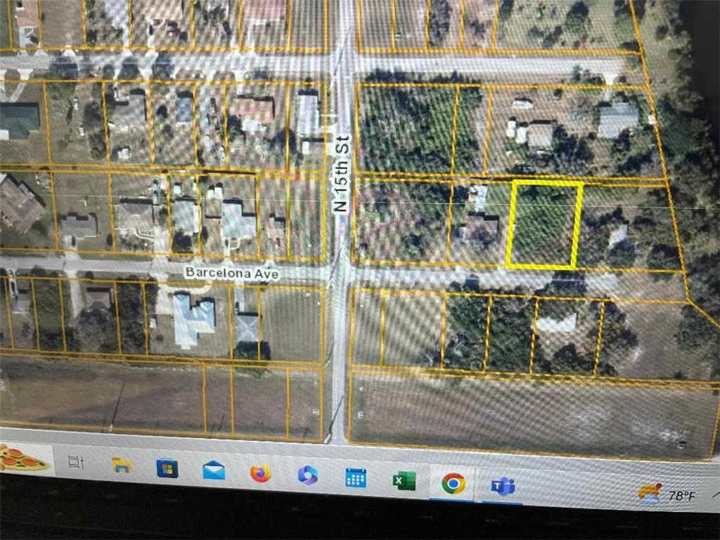 This is an aerial map showing a vacant lot highlighted in yellow near a street intersection — O BARCELONA AVE, Fort Pierce FL 34946, FORT PIERCE, FL