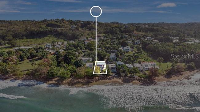 An aerial view shows a coastal house highlighted by a white line and circle — 40 CALLE SURF BO ENSENADA, RINCON, PR