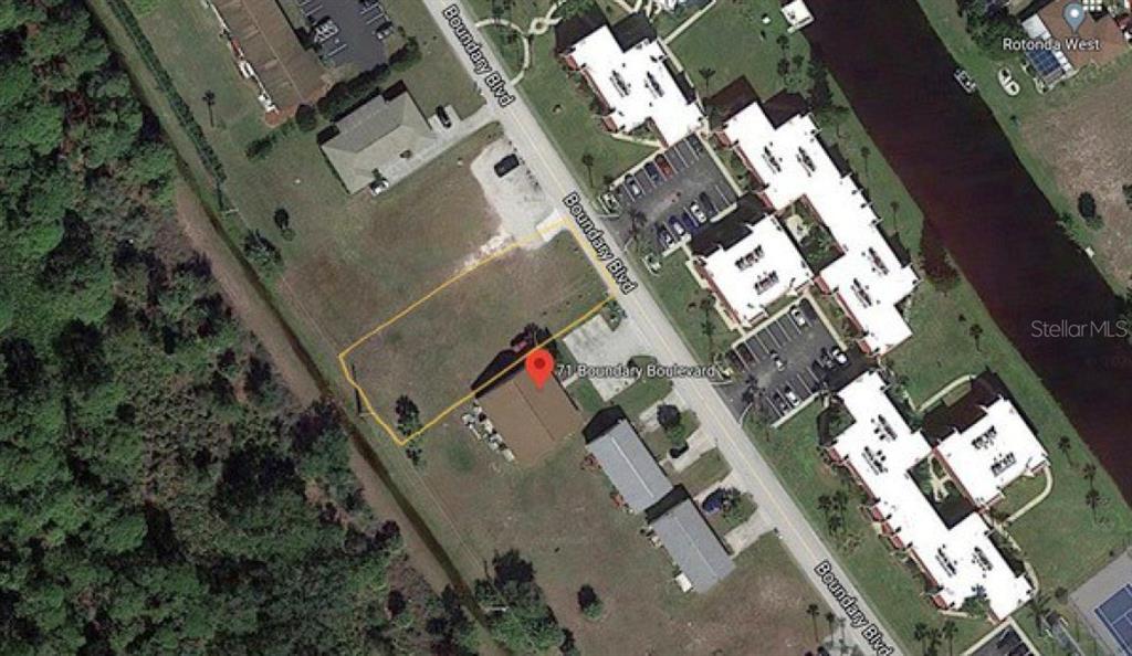 An aerial map view shows a rectangular property lot with a building and surrounding vegetation — 71 BOUNDARY BOULEVARD, ROTONDA WEST, FL