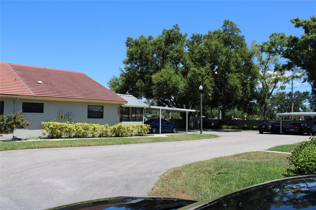 A single-story building with a red tile roof and a covered carport area — 2288 CITRUS COURT, CLEARWATER, FL