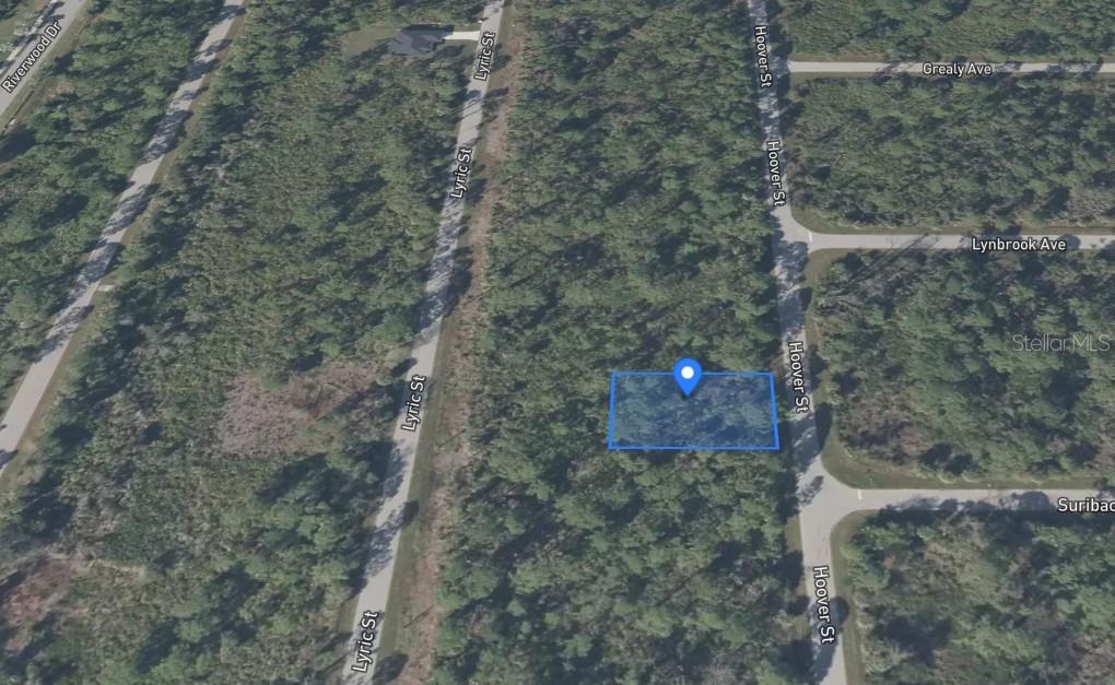 An aerial map view shows a rectangular plot of land highlighted in blue near roads — 2489 HOOVER STREET, PORT CHARLOTTE, FL