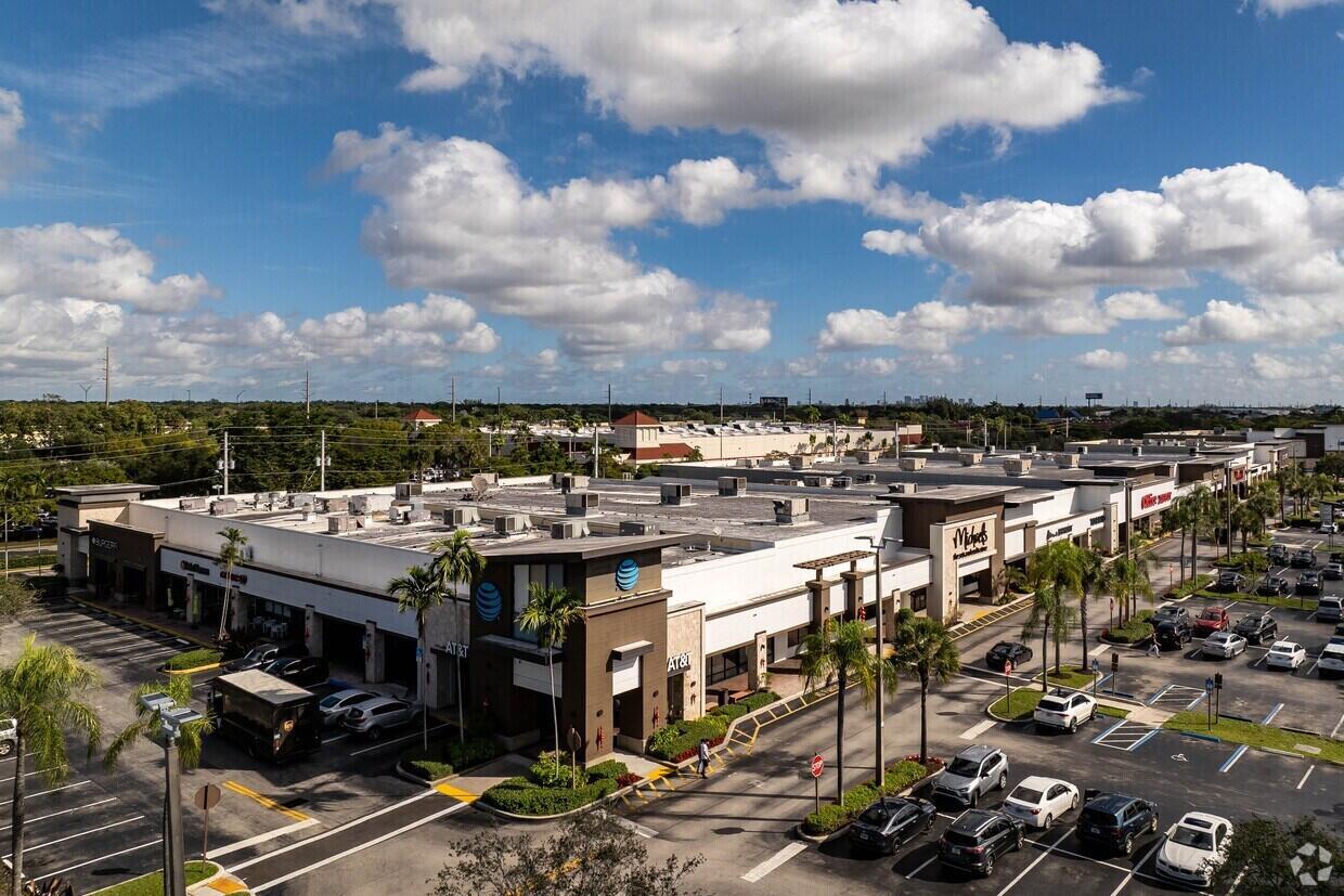 An aerial view of a commercial shopping center with a parking lot and blue sky — 2054 S University Drive, Davie FL 33324, DAVIE, FL