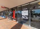 A storefront with a glass facade and a red pillar under a covered walkway — 2054 S University Drive, Davie FL 33324, DAVIE, FL