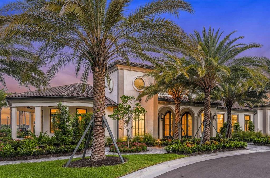 A bathroom features a soaking tub, a glass-enclosed shower, a double vanity, and tile flooring — 332 BOCELLI DRIVE, NORTH VENICE, FL