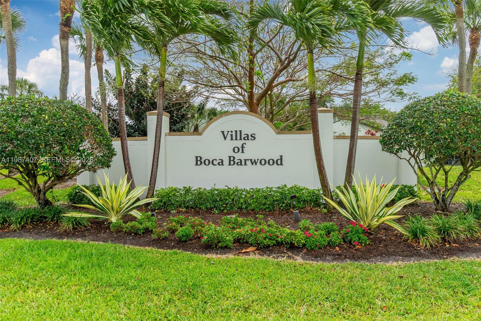 A white monument sign for Villas of Boca Barwood sits amidst landscaping and palm trees — 23318 SW 55th Way # B, Boca Raton FL 33433, BOCA RATON, FL