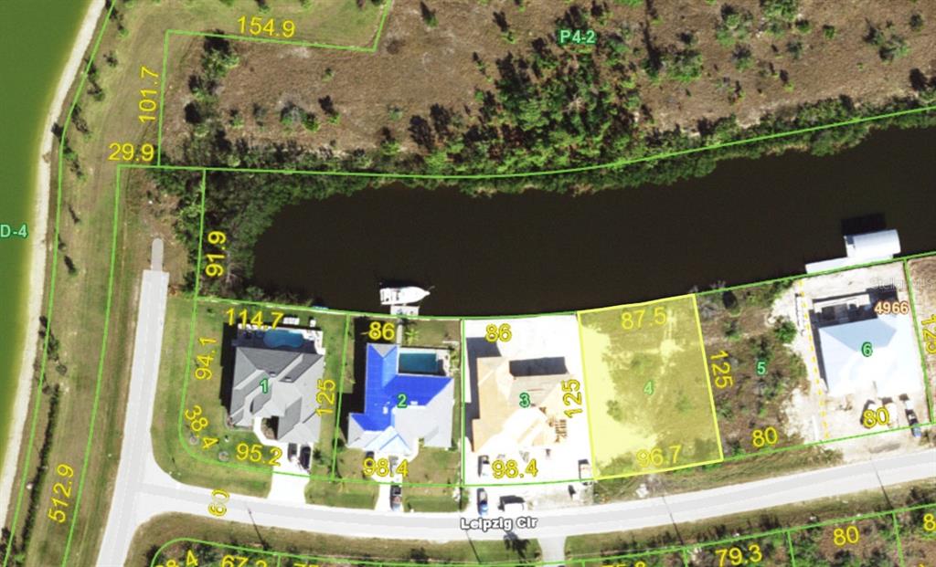 This is an aerial map showing residential lots and a small lake on Leipzig Circle — 15076 LEIPZIG CIRCLE, PORT CHARLOTTE, FL