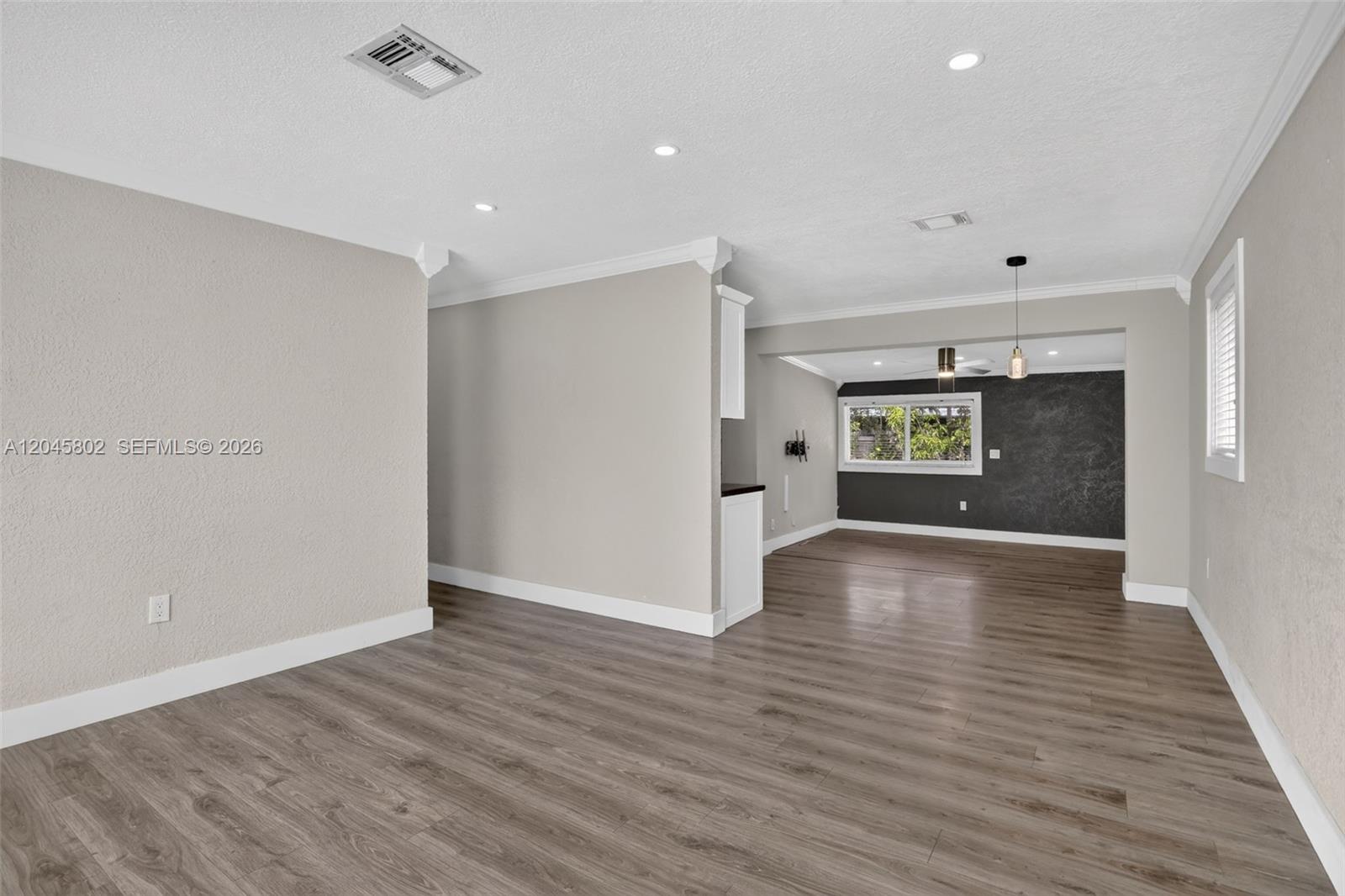 A backyard patio features a sectional sofa, dining set, string lights, and a storage shed — 1300 N 70th Ter, Hollywood FL 33024, HOLLYWOOD, FL