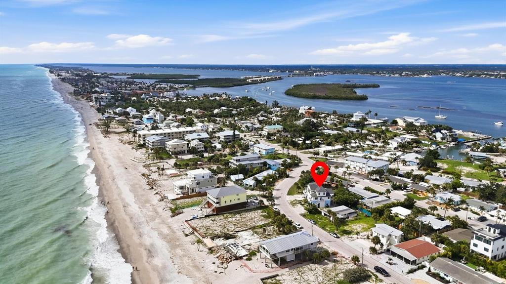 An aerial view shows a coastal neighborhood with a red pin marking a specific house — 1245 SHORE VIEW DRIVE, ENGLEWOOD, FL