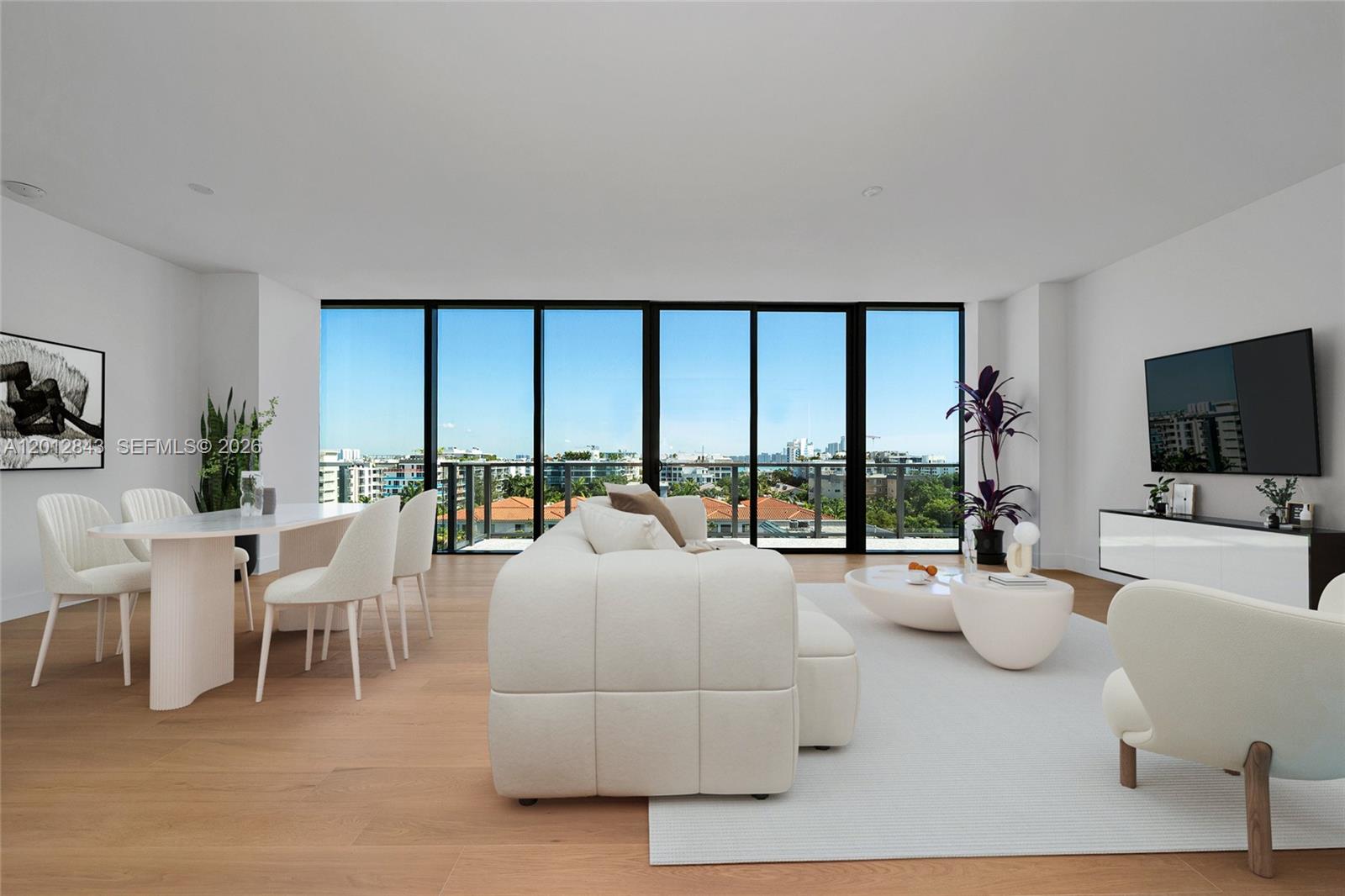 A modern living room features a beige sectional, two armchairs, and floor-to-ceiling windows — 1176 97th St # 809, Bay Harbor Islands FL 33154, BAY HARBOR ISLANDS, FL