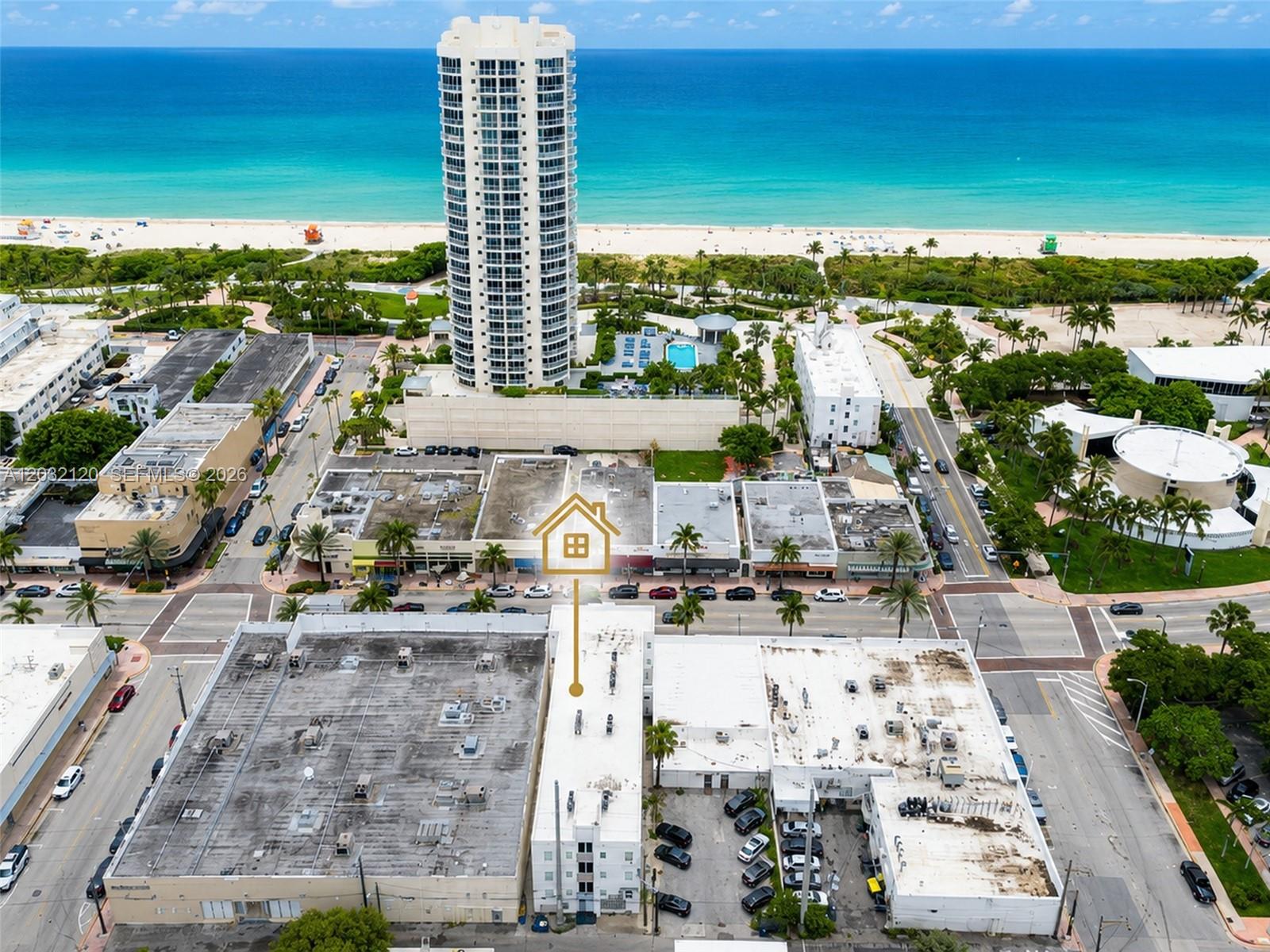 An aerial view shows a multi-story building with a highlighted roof near the beach — 7326 Collins Ave # 203, Miami Beach FL 33141, MIAMI BEACH, FL