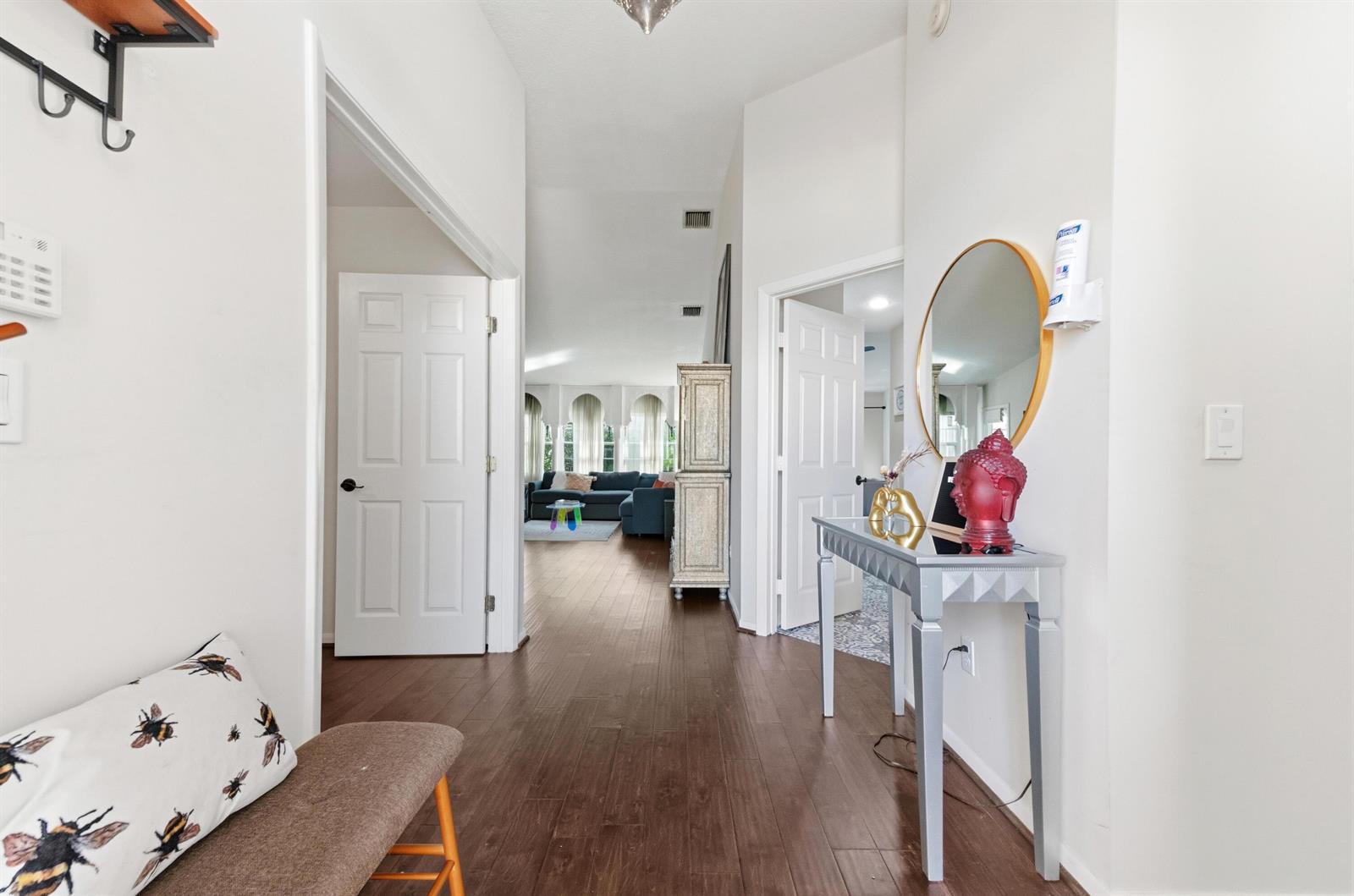 A hallway with dark wood floors leads to a living area with white walls — 17221 Boca Club Boulevard # 3, Boca Raton FL 33487, BOCA RATON, FL