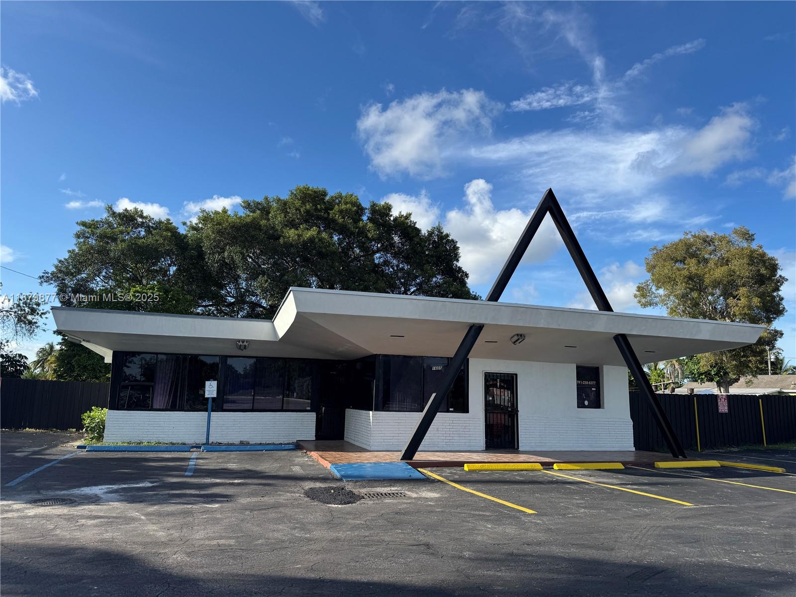 A single-story commercial building features a distinctive A-frame support structure and a flat, overhanging roof — 1605 NW 95th St, Miami FL 33147, MIAMI, FL