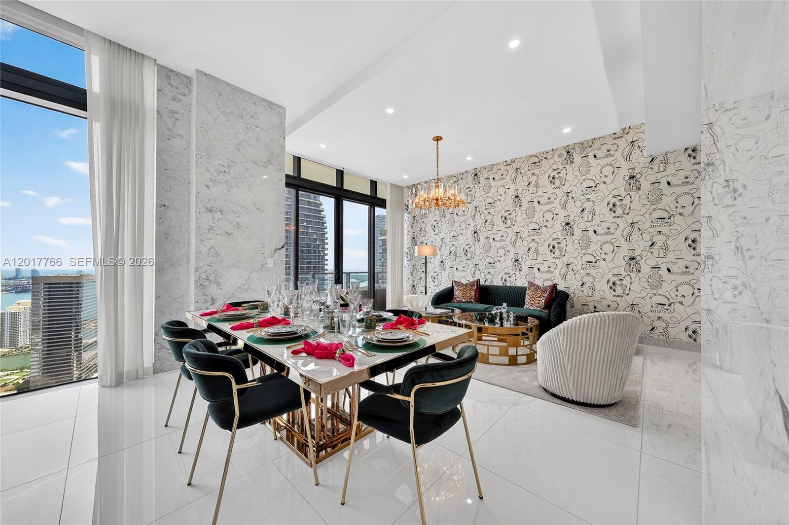 A dining and living area features marble walls, patterned wallpaper, and floor-to-ceiling windows — 88 SW 7th St, Miami FL 33130, MIAMI, FL