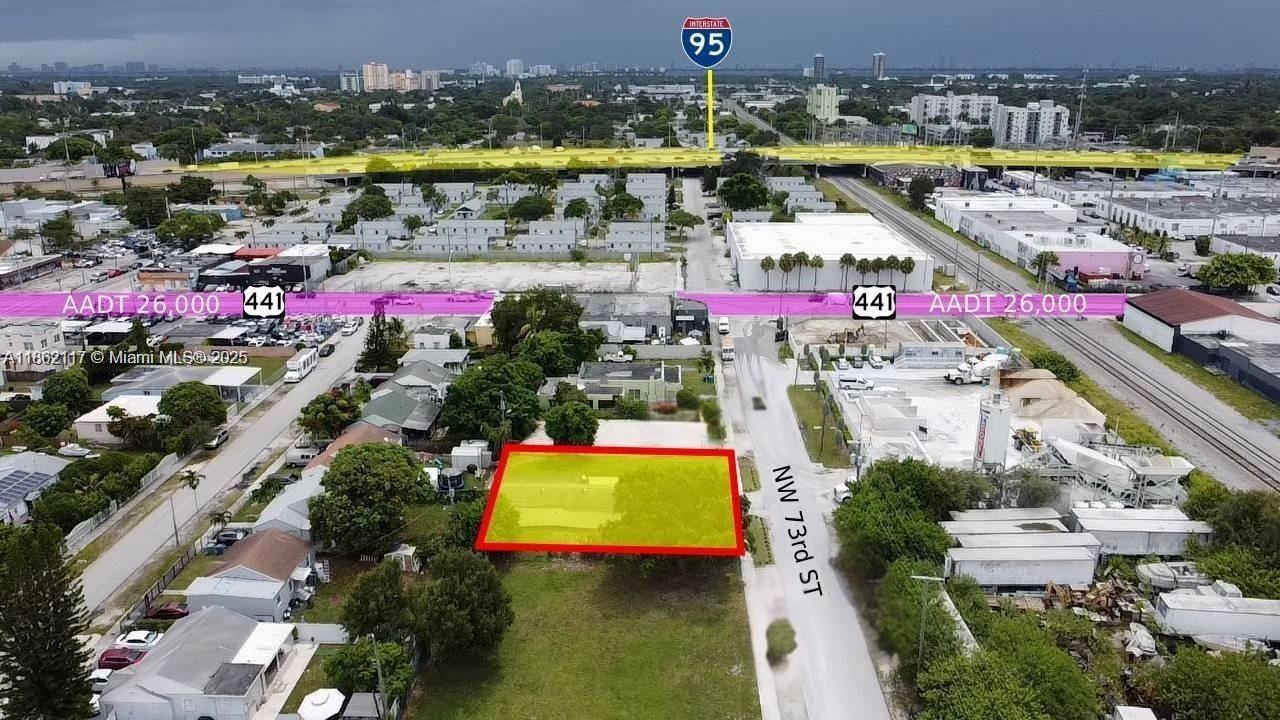 An aerial view shows a rectangular lot highlighted in yellow next to a paved road — 759 NW 73rd ST, Miami FL 33150, MIAMI, FL