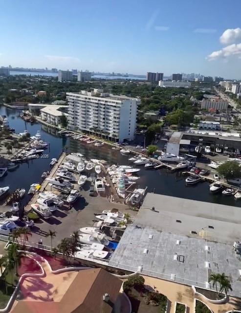 An aerial view shows a marina filled with boats next to a large apartment building — 13499 Biscayne Blvd # 902, North Miami FL 33181, NORTH MIAMI, FL