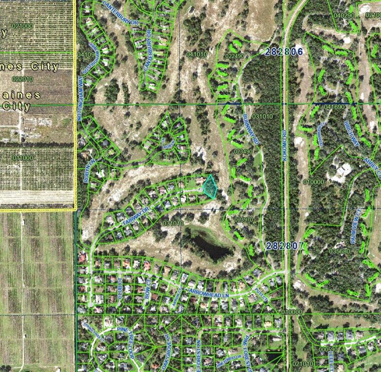 This is a satellite map showing residential streets, wooded areas, and a highlighted property lot — FAIRWAY DRIVE, HAINES CITY, FL