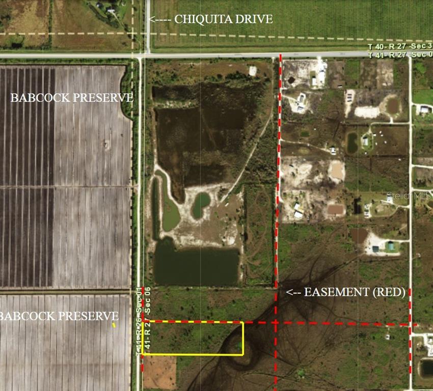 This is an aerial map showing a property boundary, a red easement line, and surrounding land — 48105 BERMONT ROAD, PUNTA GORDA, FL