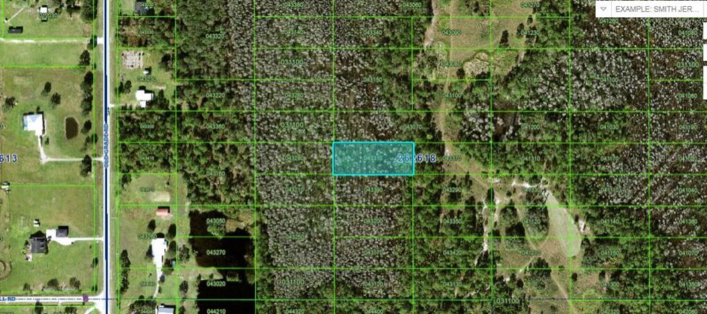An aerial map shows a highlighted rectangular plot of land surrounded by dense vegetation — OLD GRADE RD, POLK CITY, FL