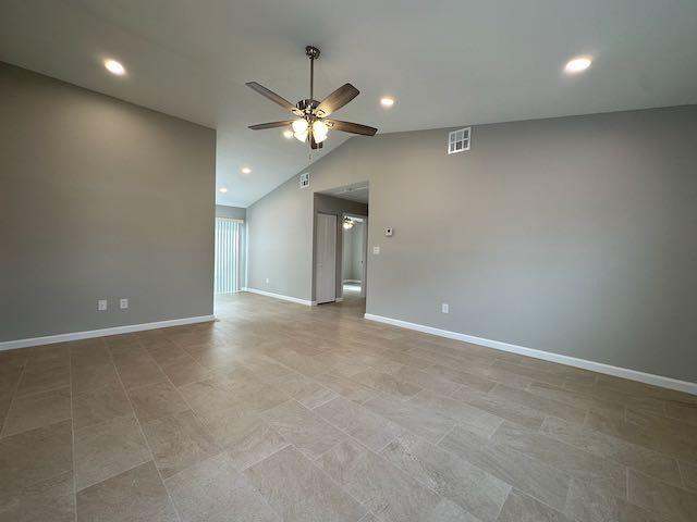 An empty room features light-colored tile flooring, gray walls, and a ceiling fan — 3166 SE Garden Street # 3166, Stuart FL 34997, STUART, FL