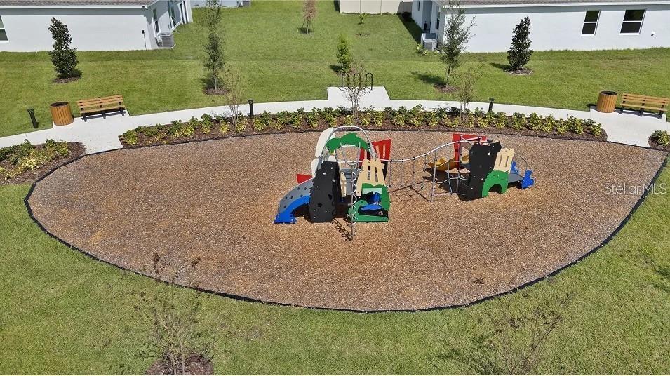 An aerial view shows a playground with climbing equipment set in a wood-chipped area — 3419 ROVER ROAD, EAGLE LAKE, FL