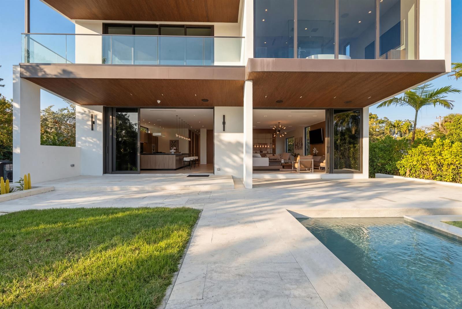 A modern two-story house with a pool, patio, and large sliding glass doors — 930 S Shore Drive, Miami Beach FL 33141, MIAMI BEACH, FL