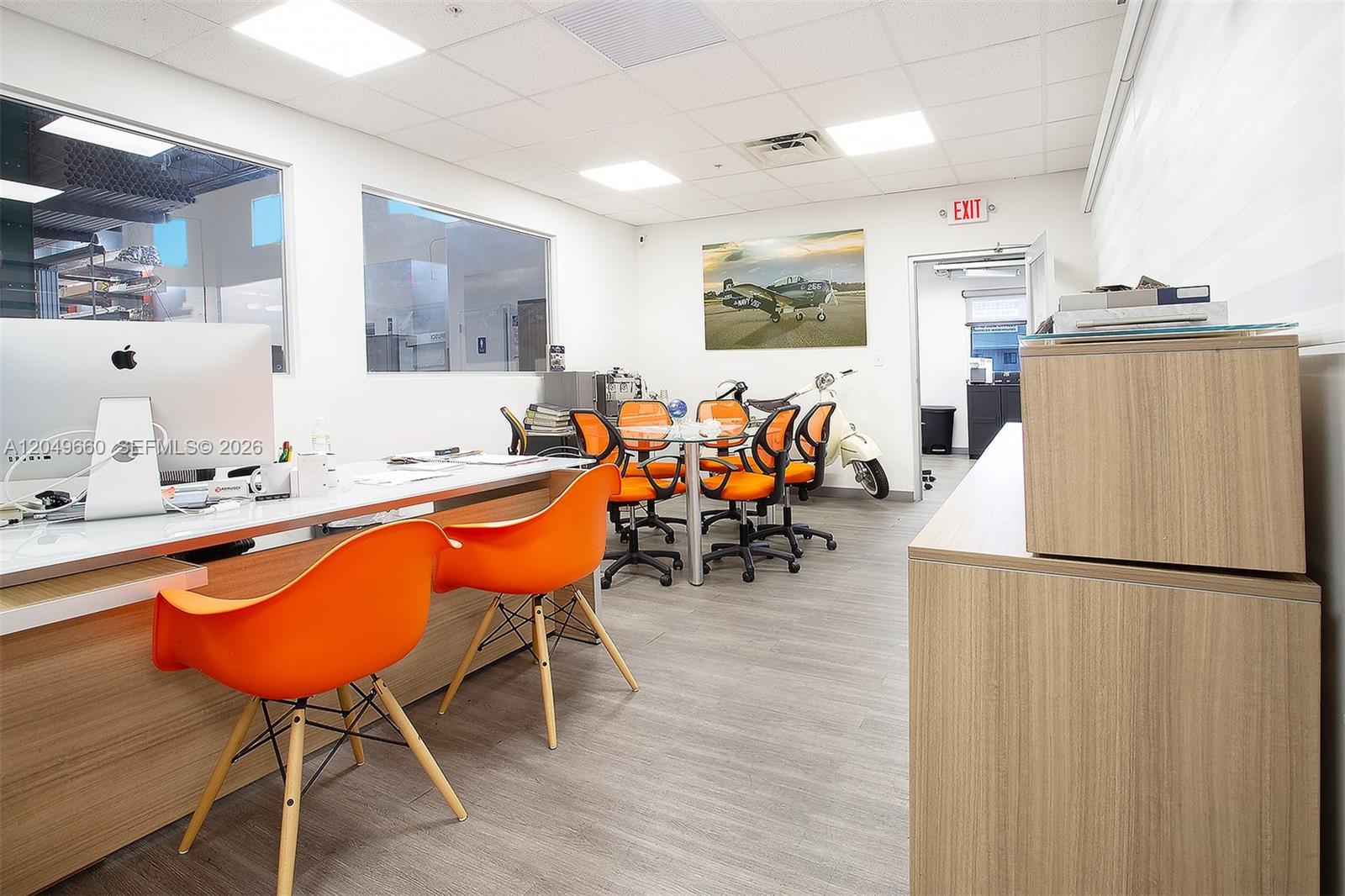 An office space features orange chairs, a glass conference table, and a white desk — 2290 W 8th Ave, Hialeah FL 33010, HIALEAH, FL