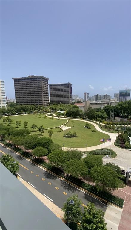 An elevated view shows a park with walking paths, trees, and surrounding city buildings — 1511 PONCE DE LEON AVENIDA UNIT 1052, SAN JUAN, PR