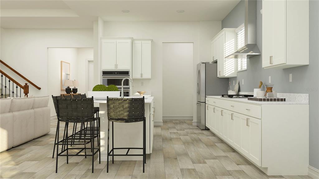 This is a rendering of a modern kitchen featuring white cabinetry, a central island, and stools — 11580 69T PLACE E, PALMETTO, FL