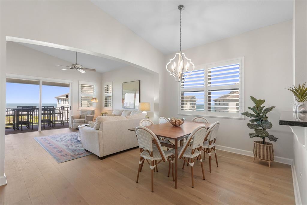 A living room features a patterned rug, a white coffee table, and a television console — 400 CINNAMON BEACH WAY UNIT 365, PALM COAST, FL