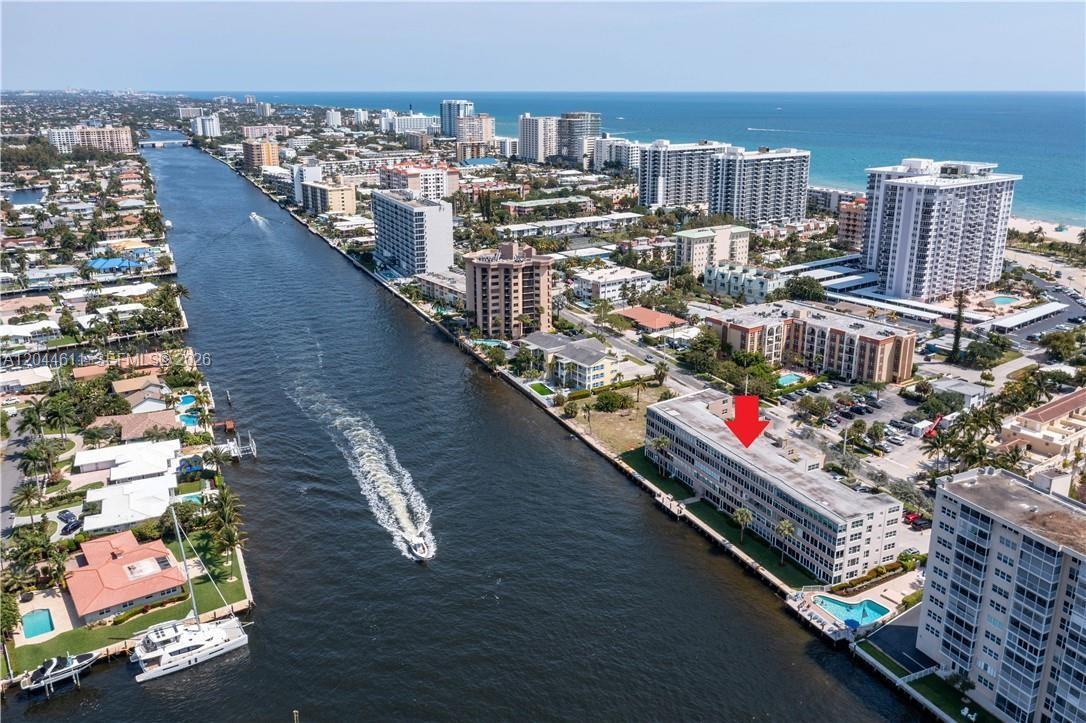 A street-level view of the Pompano Beach Fisher Family Pier entrance and nearby restaurants — 401 N Riverside Dr # 504, Pompano Beach FL 33062, POMPANO BEACH, FL